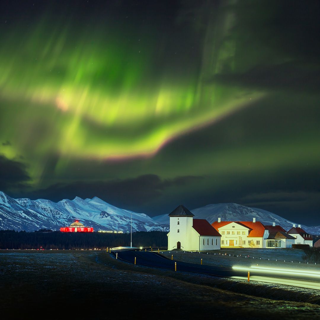Northern lights over Bessastadir and Perlan