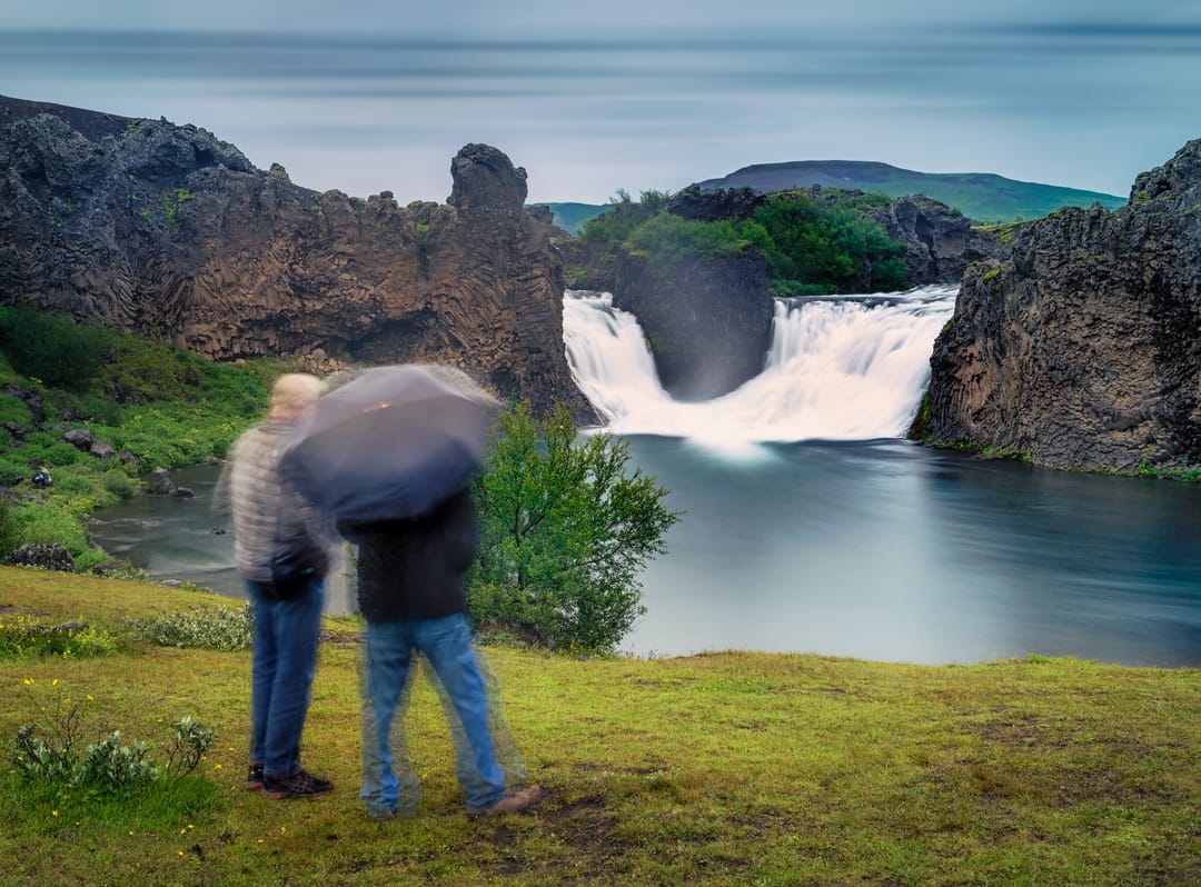 hjalparfoss with people in the rain