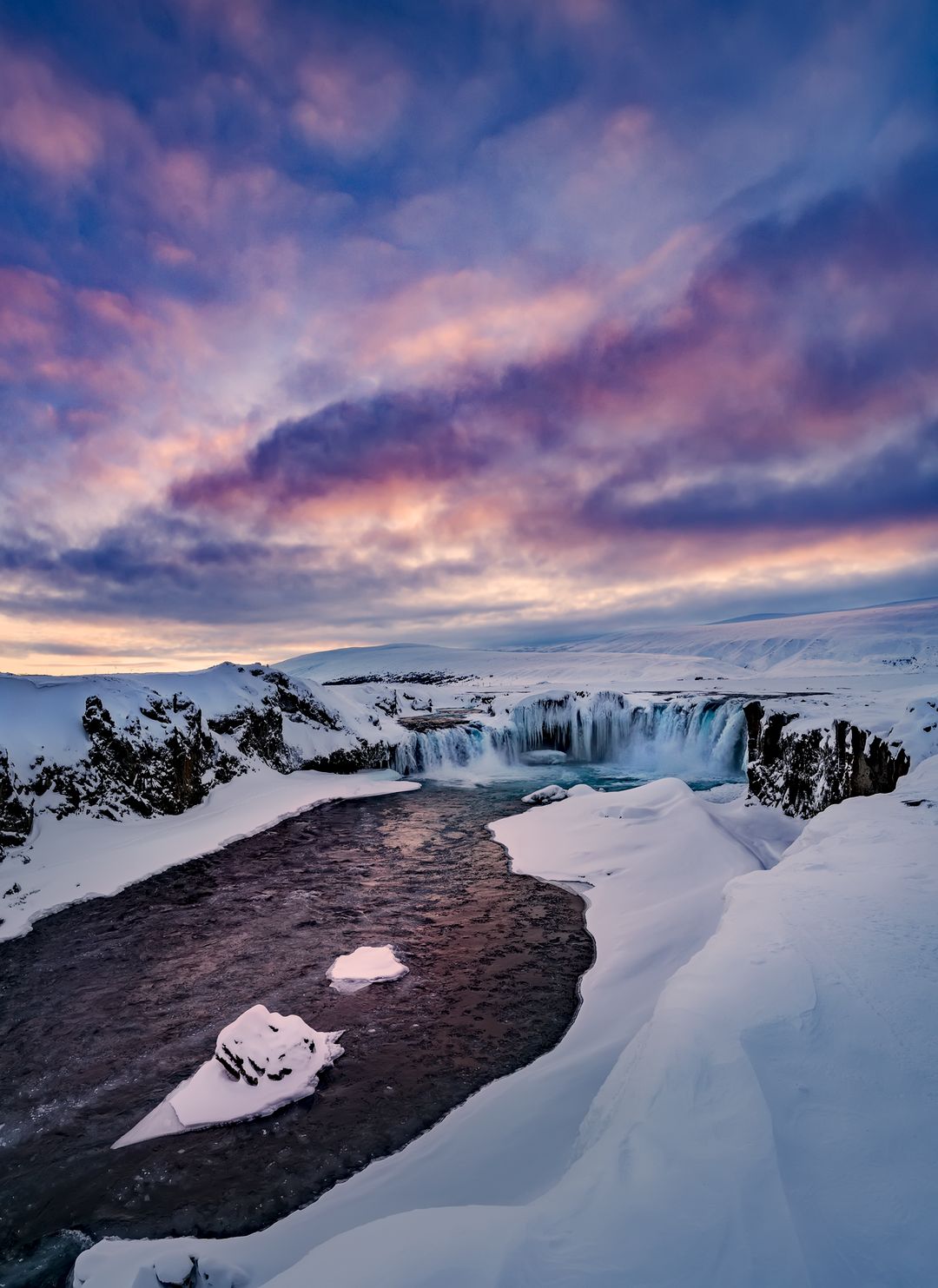 Hrafnabjargarfoss waterfall in the winter with snow
