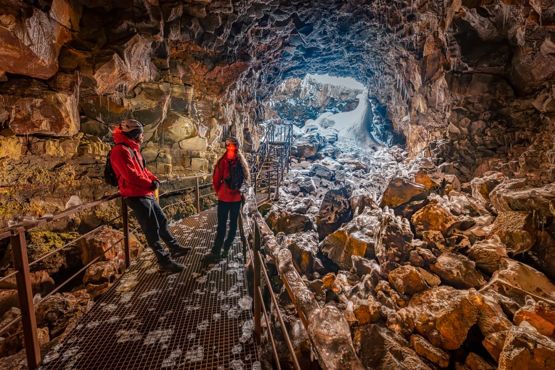 Tourists at Lava tube in Iceland