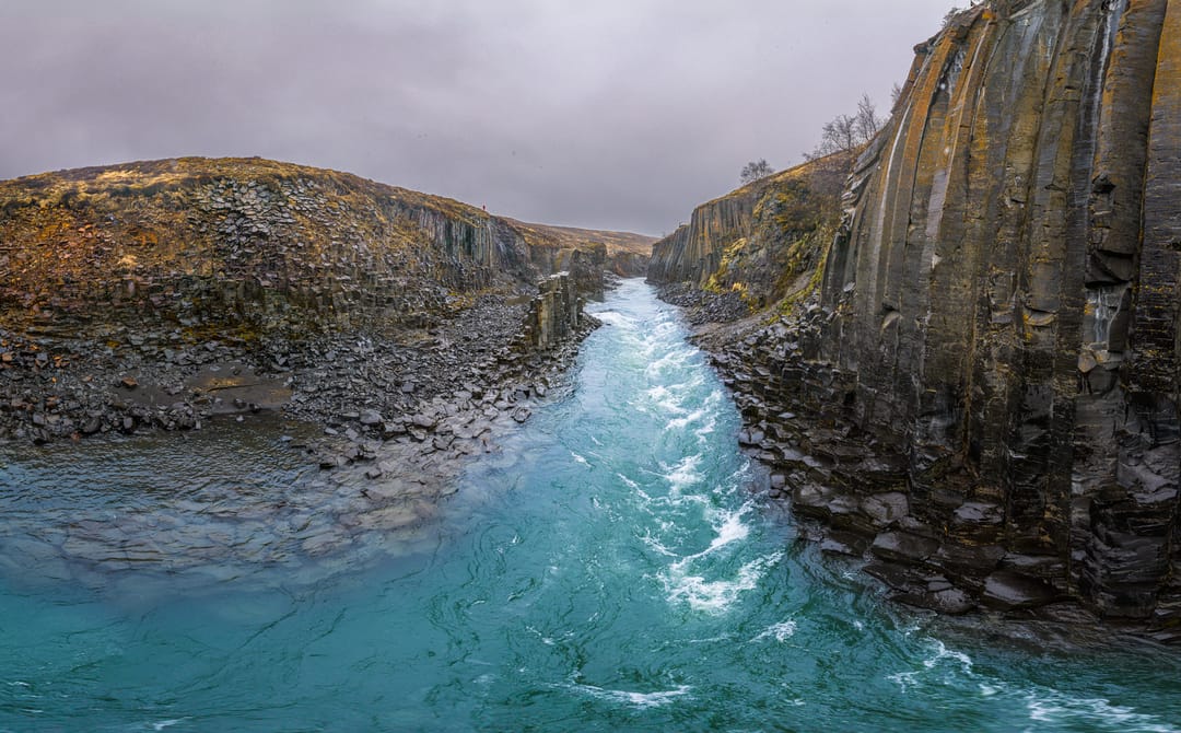 Close up of the water and basalt columns in Stuðlagil Iceland