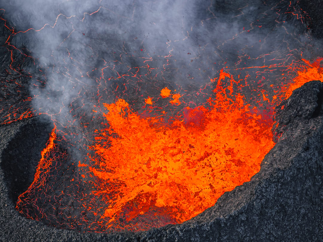 Lava bursting out of volcanic crater