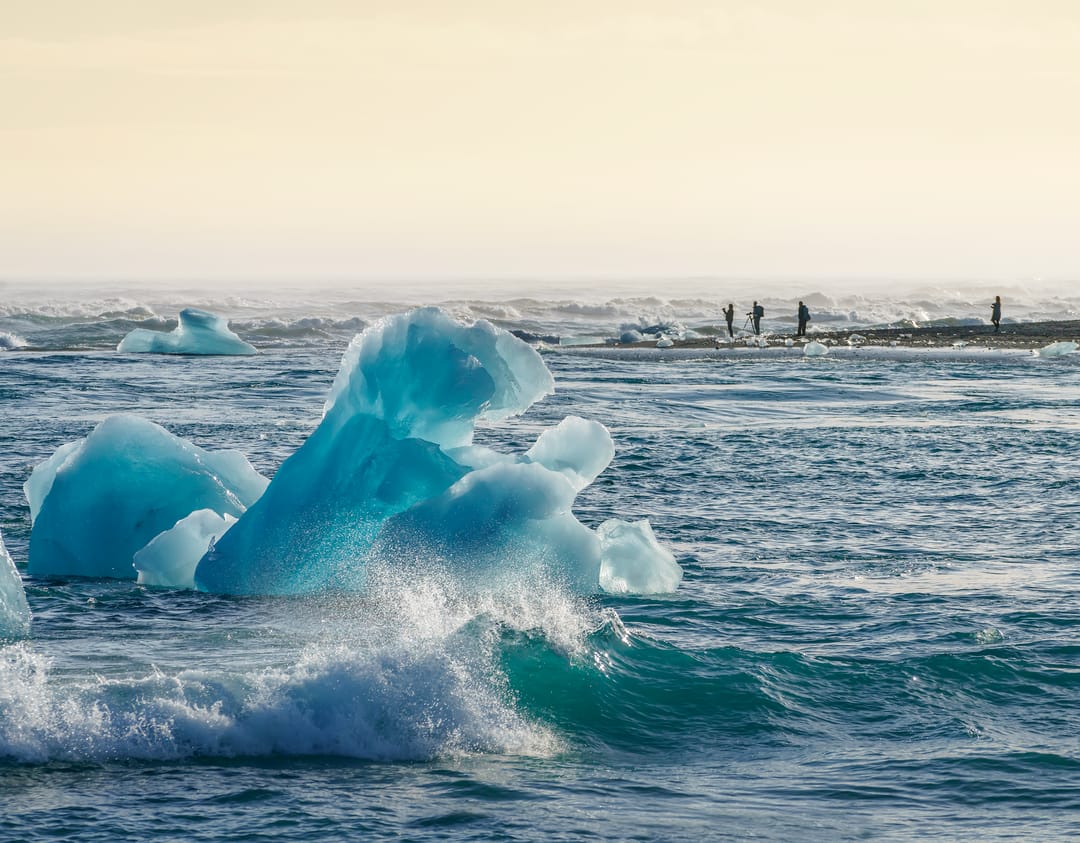 an iceberg in the ocean by diamond beach