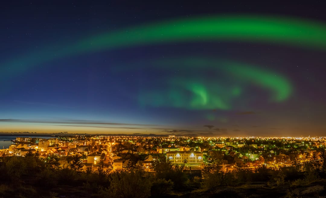 Northern lights over Reykjavik city