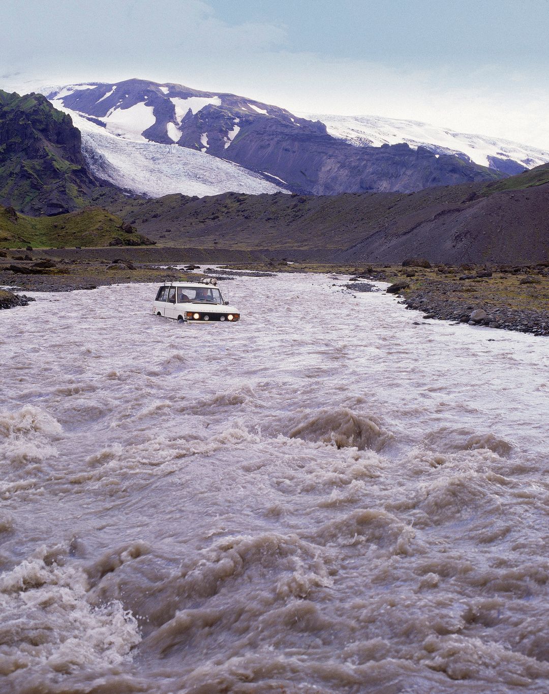 a jeep deep in the river in Thorsmork