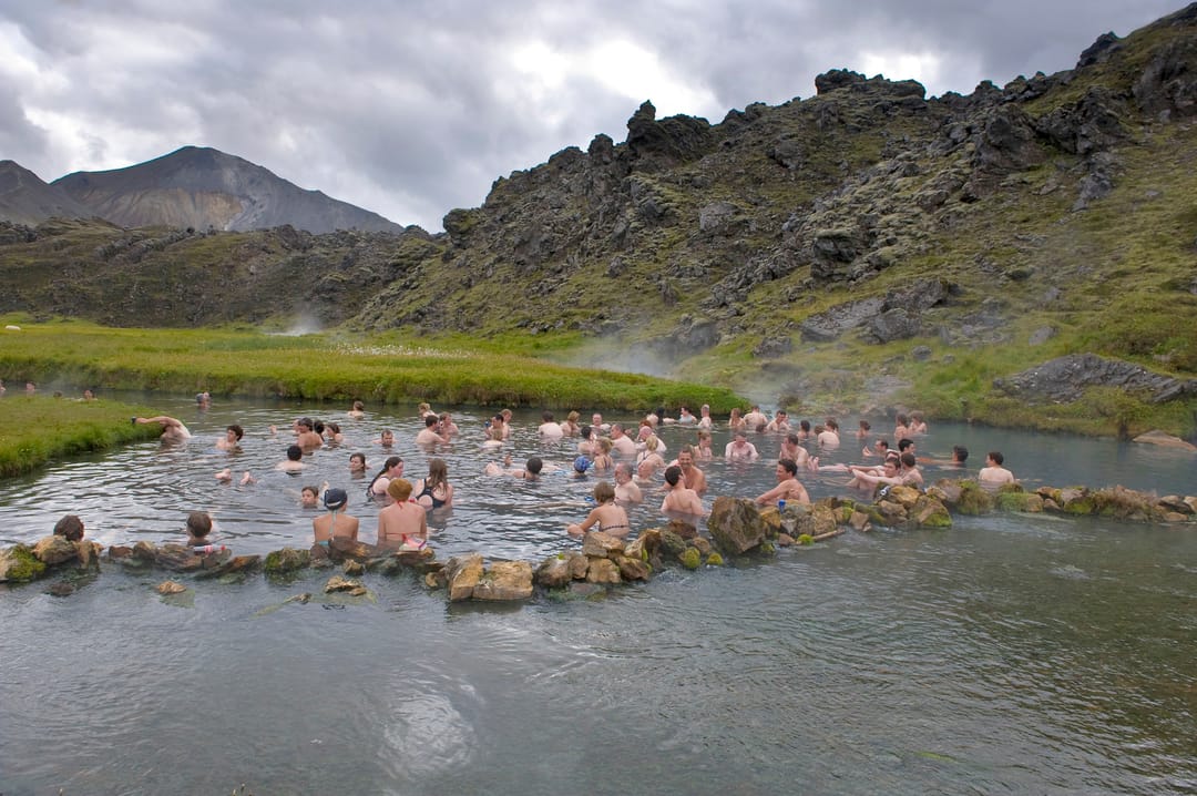 group of people bathing in hot sping in landmannalaugar