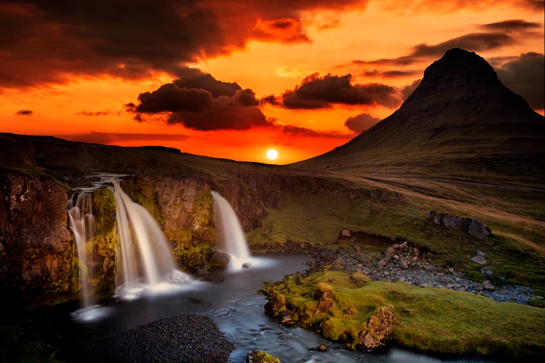 Kirkjufellsfoss Waterfall during sunset with Mt. Kirkjufell in background