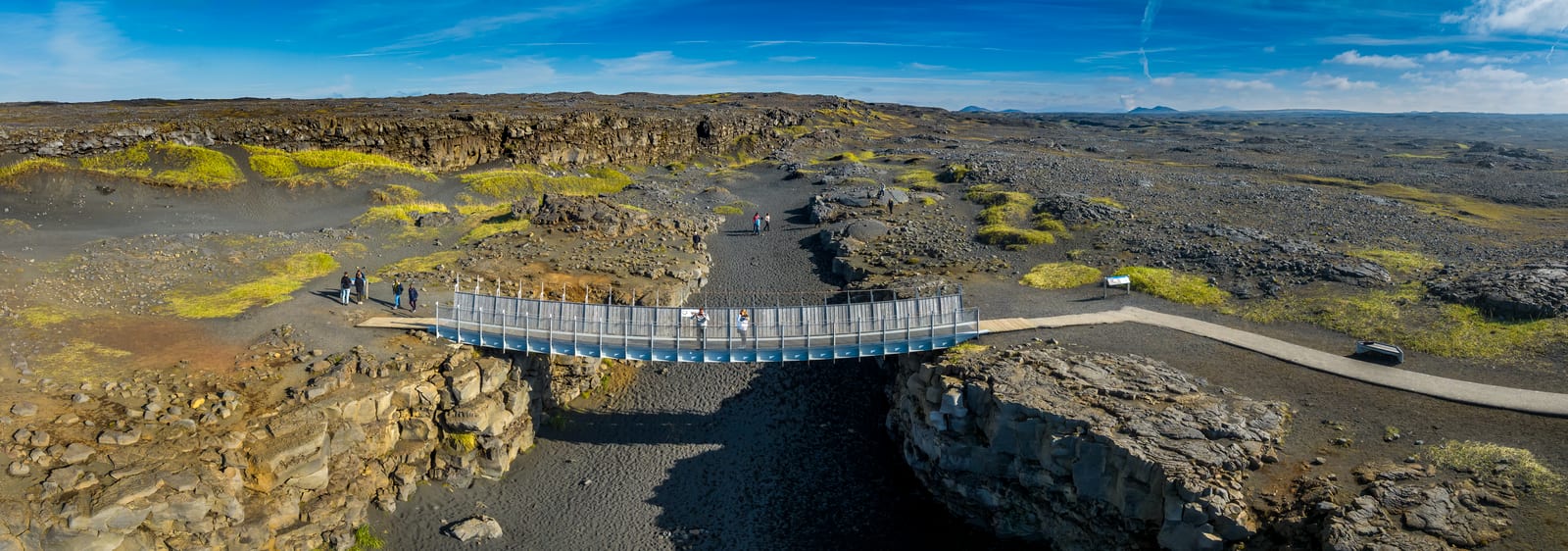 Bridge Between Continents spanning a lava fissure