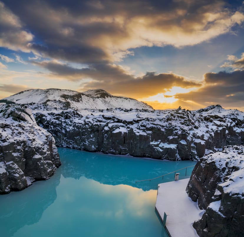 blue lagoon over winter with snow on lava rocks