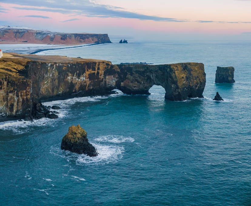 Dyrhóley during sunset with blue ocean