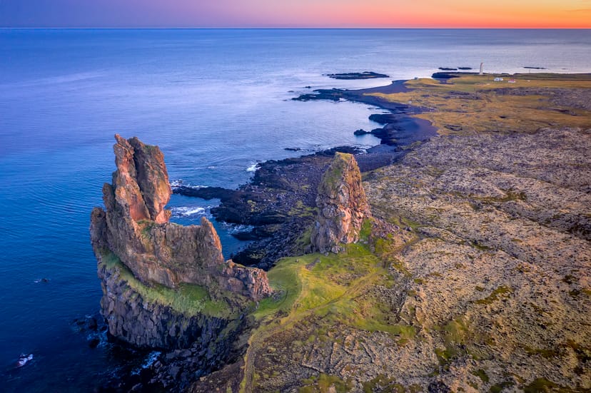steep cliffs on the edge of the coast during sunset
