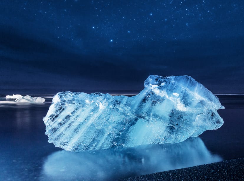 small iceberg at night at the diamond beach iceland